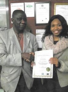Volunteer receiving certification on completion of a course