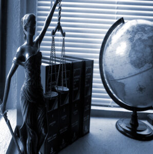 Lady justice statue, books and a globe